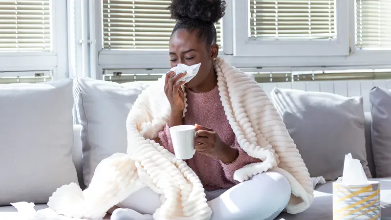 woman has runny nose and common cold