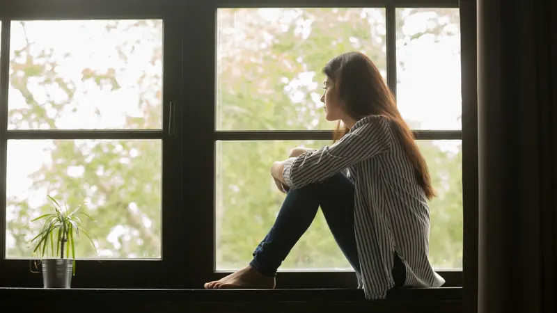 young pensive woman feeling lonely