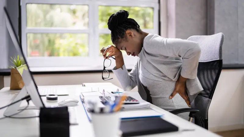 Woman Sitting In Office