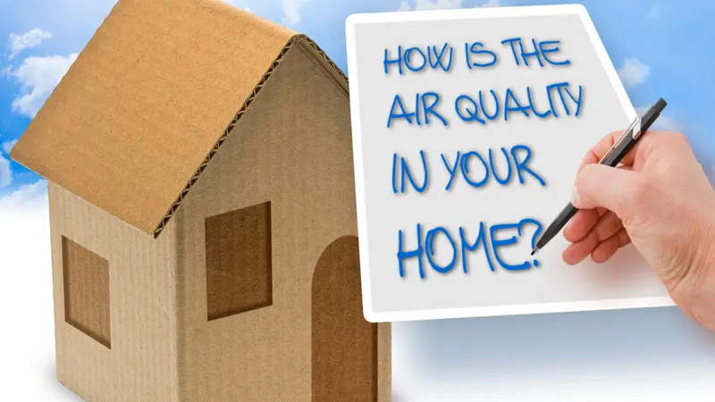 HOW IS THE AIR QUALITY IN YOUR HOME? - concept with a cardboard house