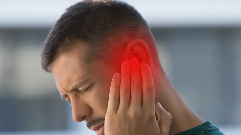 Man suffering from tinnitus