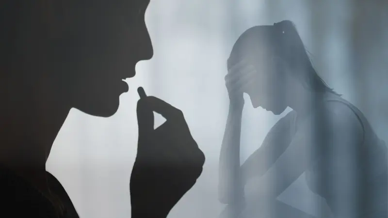 Mental depression. Woman swallowing medication pill. 