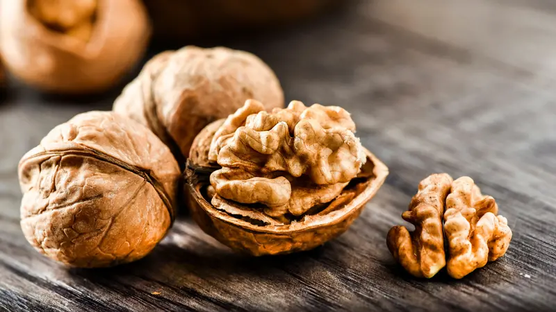 Walnuts on dark vintage table