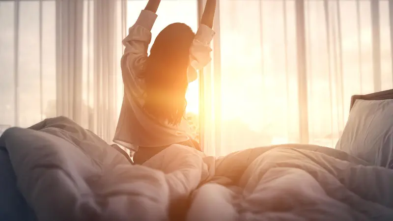Woman streching in morning light
