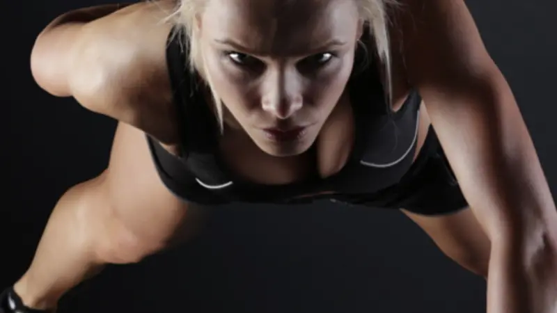 Woman doing one arm pushup