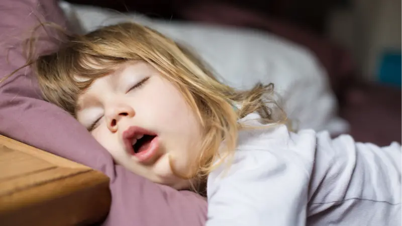 Child sleeping with an open mouth