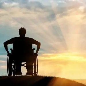 Person in wheelchair enjoying the rays of the sun