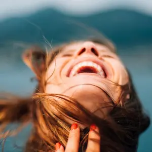 Woman with head back expressing joy