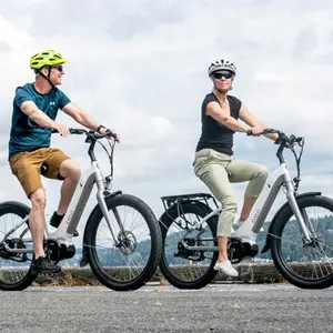 Man and woman riding electric bicycles Man and woman riding electric bicycles
