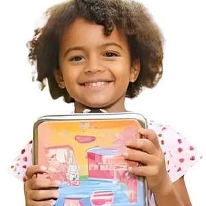 Girl holding her lunch box Girl holding her lunch box