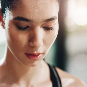 female athlete sweating after workout female athlete sweating after workout