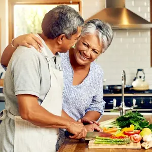 A couple cooking in the kitchen A couple cooking in the kitchen