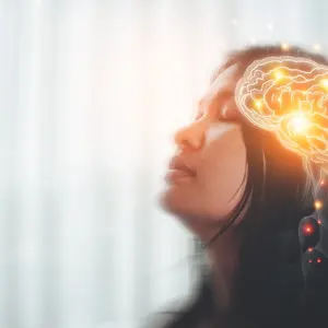 Concept are of a woman with nervous system in brain lighting up, illustrative of emerging polyvagal theory Concept are of a woman with nervous system in brain lighting up, illustrative of emerging polyvagal theory